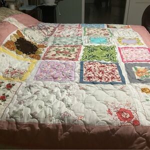 Floral Patchwork Quilt with Pink Border